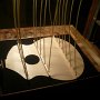 Bracing is glued to the soundboard. The clamping force is applied with the "go-bars"
