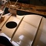 The shaped blocks are glued to the top. The small pieces of wood are temporarily glued to the blocks. They will help with the clamping of the sides to the blocks