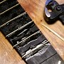 The frets are hammered in with some hide glue.